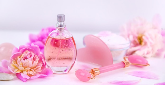 Pink flowers on white background spa facial Selective focus