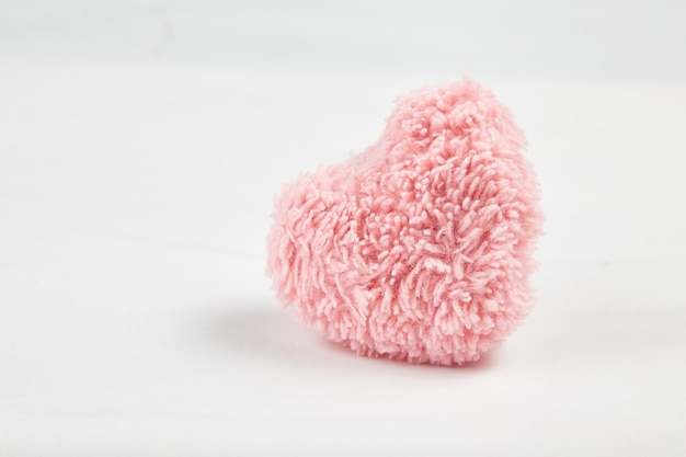 Pink fluffy heart isolated on white background