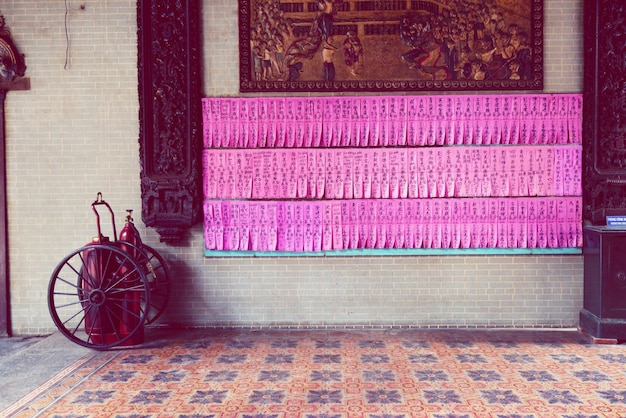 Photo pink fortune papers on wall