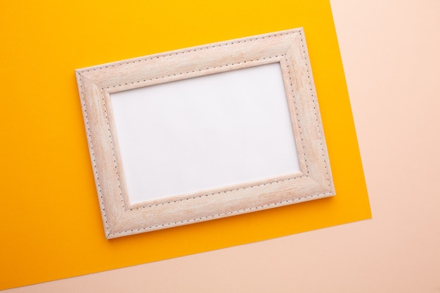 Pink frame on a pink and orange background with a place for an inscription. high quality photo