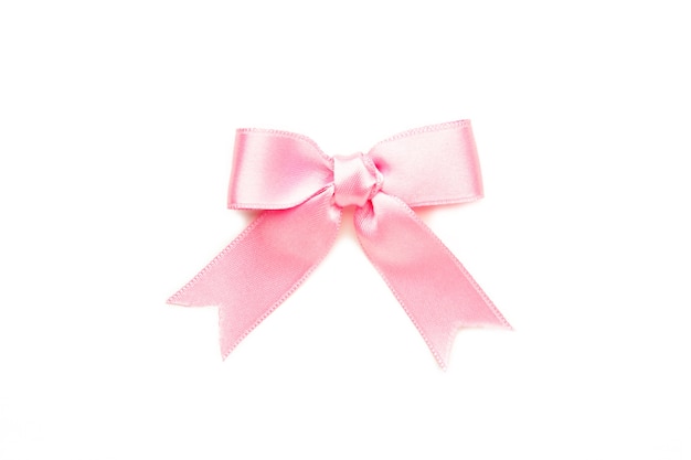 Pink gift bow isolated on white background. Top view