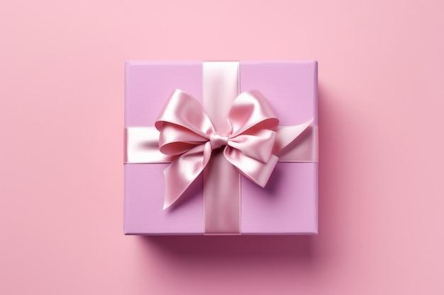 A pink gift box with a pink ribbon and a bow on a pink background.