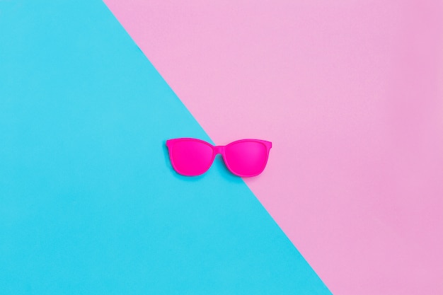 Pink glasses on coroful. Minimal concept.