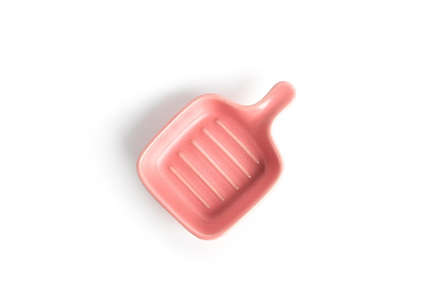 Pink gravy boat isolated on a white background. High quality photo