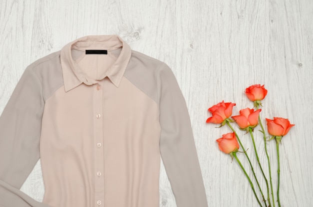 Pink and gray blouse and orange roses  , Fashionable concept,  