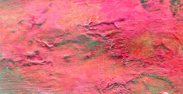 A pink and green image of a mountain range.