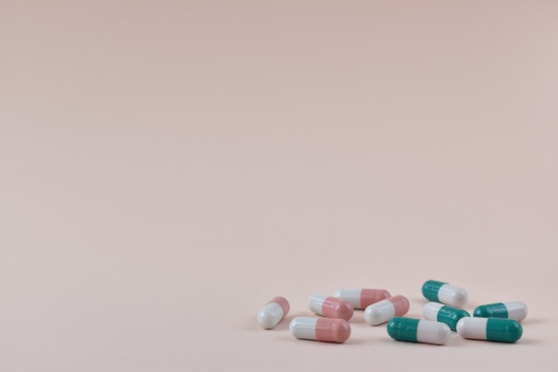 Pink and green medical capsules