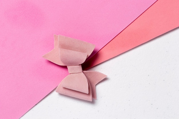 Pink HAIR BOW ON TABLE WITH BLUE FABRIC AND RIBBON