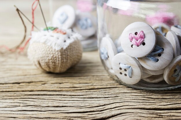 Pink heart embroidery on booton in clear bottle