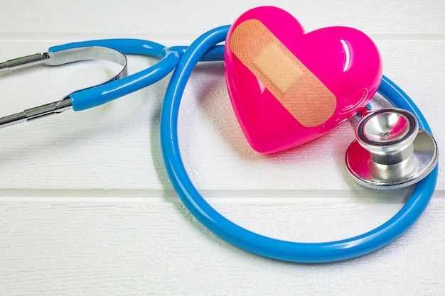 Pink heart and stethoscopes for medical content