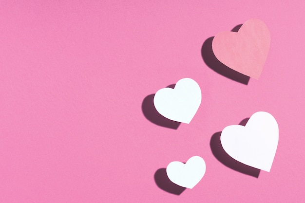 Pink hearts on pink surface