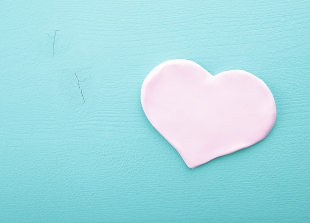 Pink hearts on a wooden texture