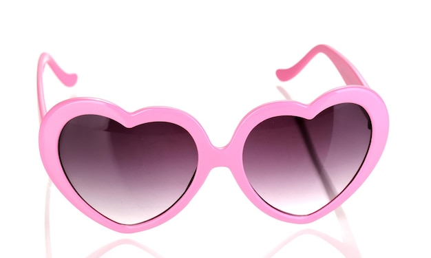 白で隔離されるピンクのハート形のサングラス