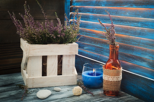 Photo pink heather in box, candle