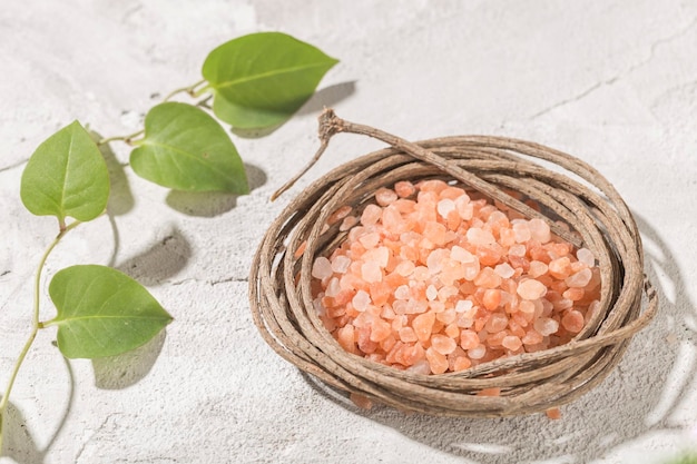 Pink himalayan salt in bowl on white background