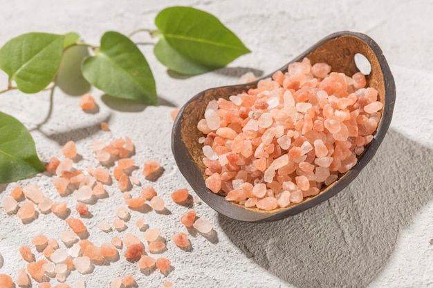 Pink himalayan salt in bowl on white background