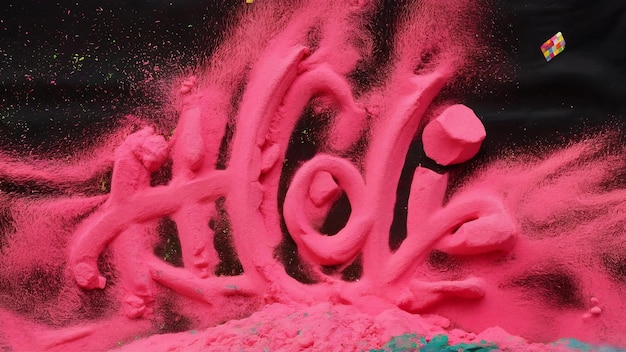 Фото pink holi powder on black surface