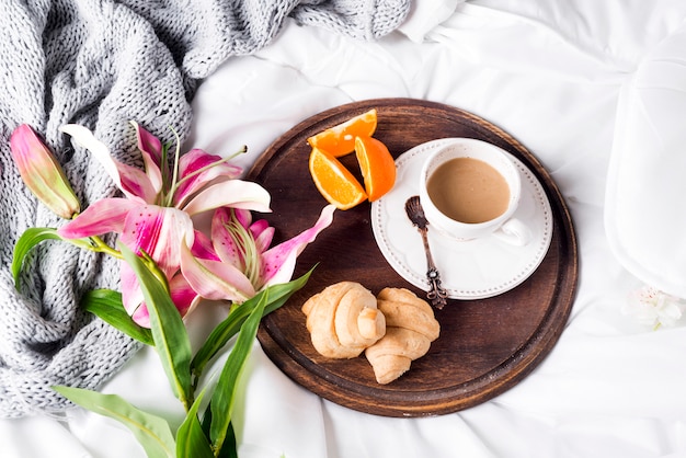 Pink lilies and coffee cup