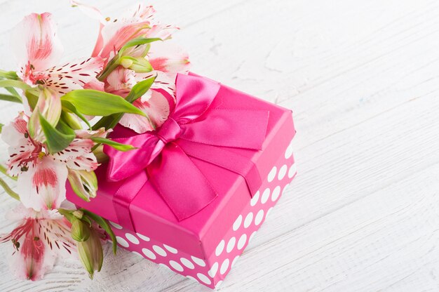 Pink lilly flowers with gift box