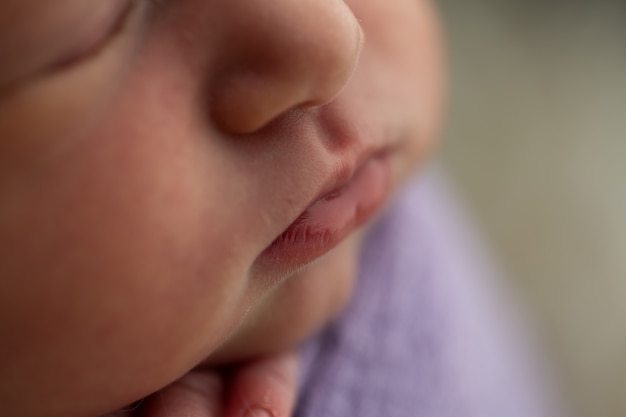 Pink lips of a sleeping baby girl