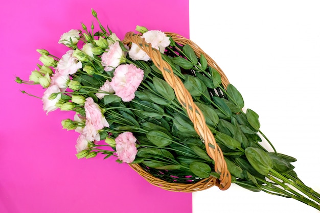 Pink lisianthus in natural wicker basket