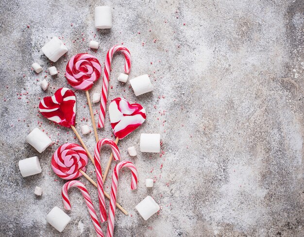 Pink lollipop, candy cane and marshmallow 