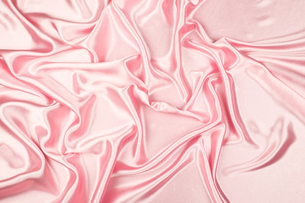 Розовая роскошная текстура ткани сатинировки для предпосылки
