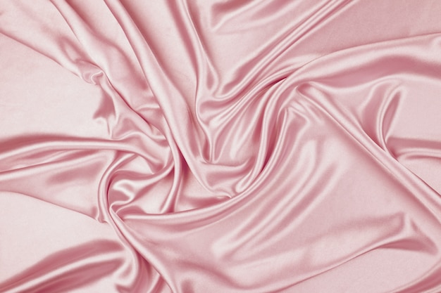 Pink luxury satin fabric texture for background