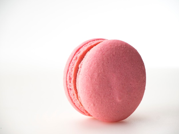 Pink macaroon on white background