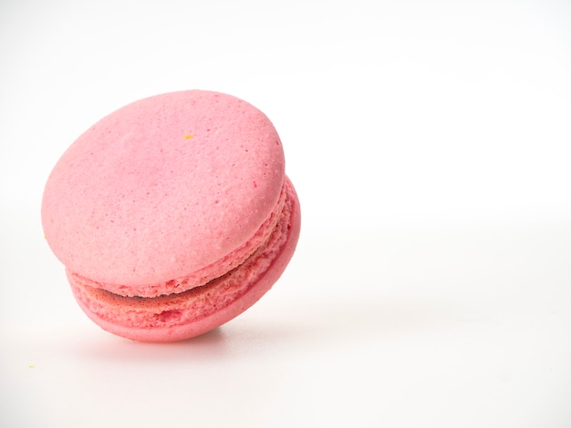 Pink macaroon on white background