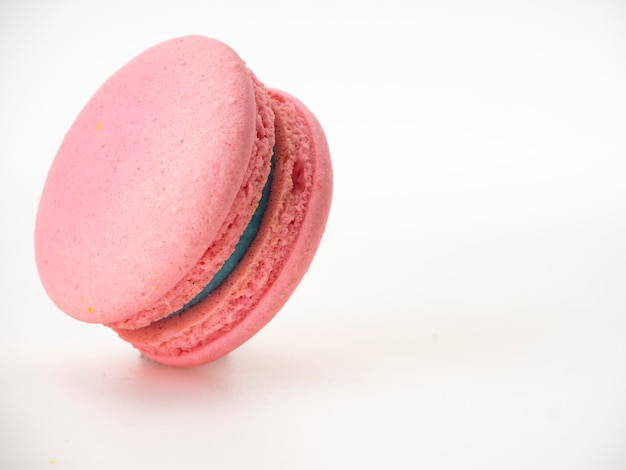 Pink macaroon on white background