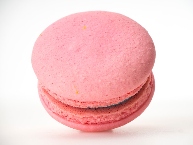 Pink macaroon on white background