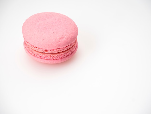 Pink macaroon on white background