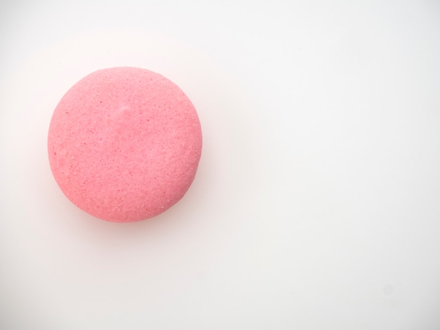 Pink macaroon on white background