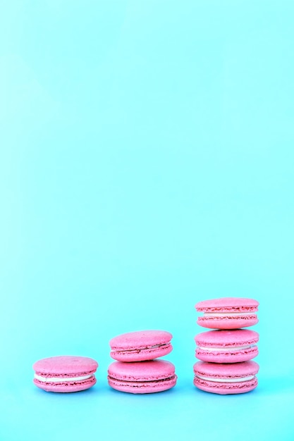 Pink macaroons on a blue background.