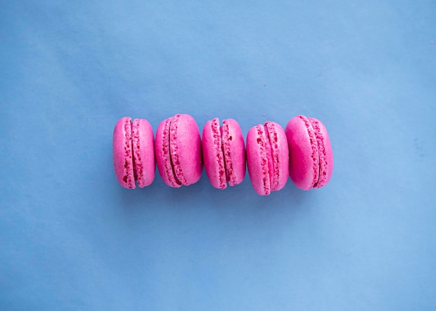 Pink macaroons on a blue background