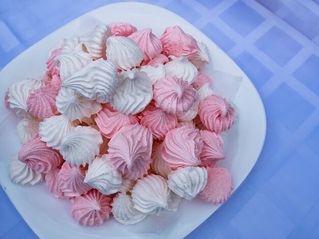 Pink marshmallow in a plate close-up