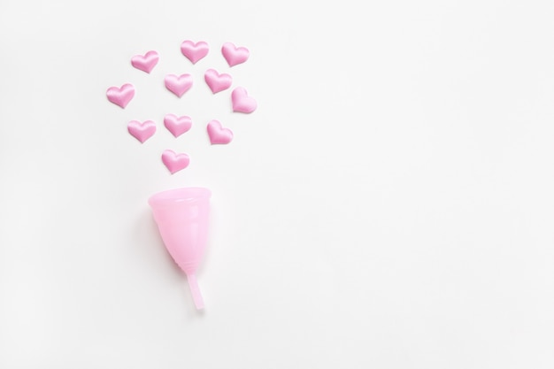 Pink menstrual cup with hearts