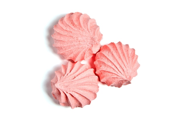 Photo pink meringue kiss cookies, airy biscuits isolated