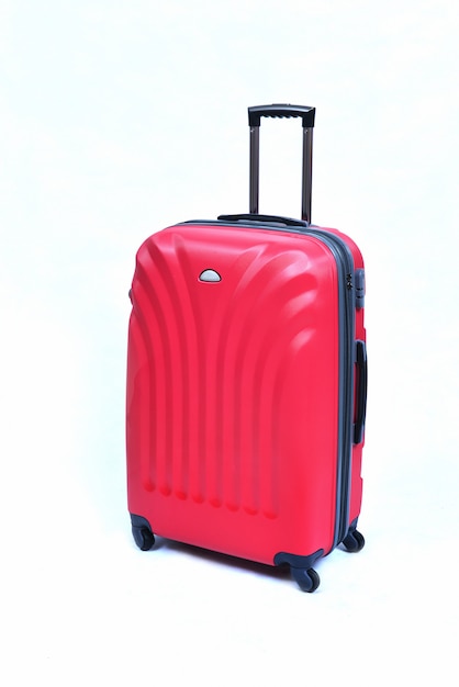 Pink of modern large suitcase on a white 