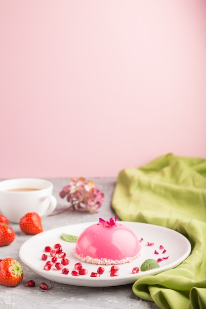 Pink mousse cake with strawberry  and a cup of coffee