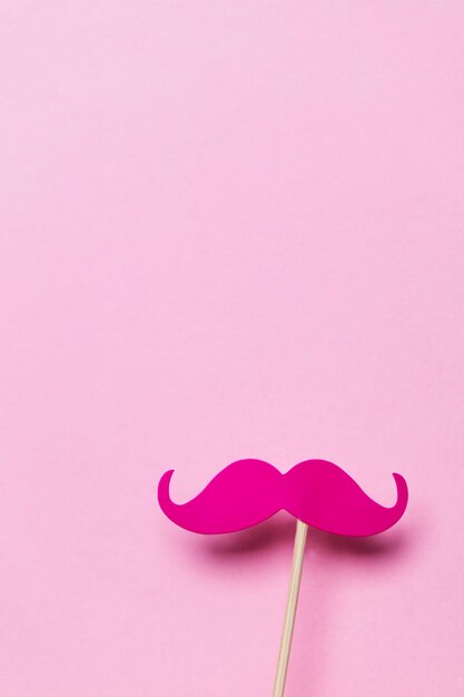 Pink moustache on a pink background Modern masculinity concept