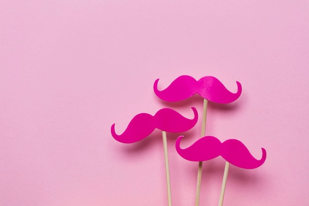 Pink moustache on a pink background Modern masculinity concept