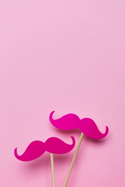 Pink moustache on a pink background Modern masculinity concept