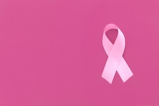 Photo pink october pink ribbon on pink background