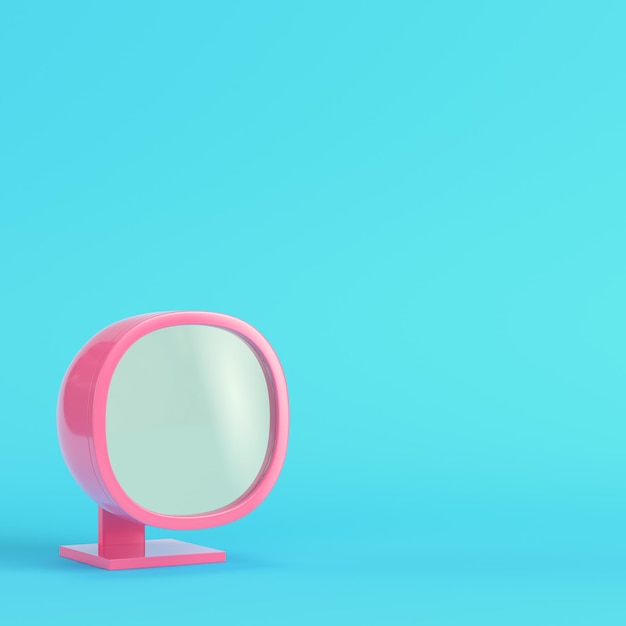 Pink oldstyled monitor on bright blue background in pastel colors