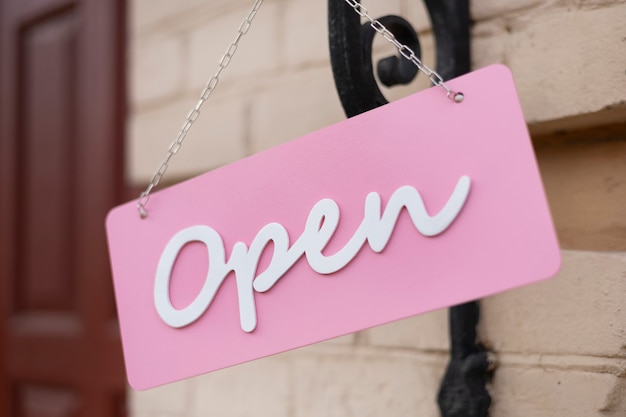Photo pink open sign hanging