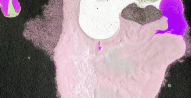 A pink paint with a purple stain is on the wall.