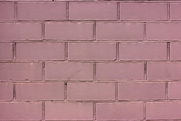 Pink painted brick wall. Monochrome