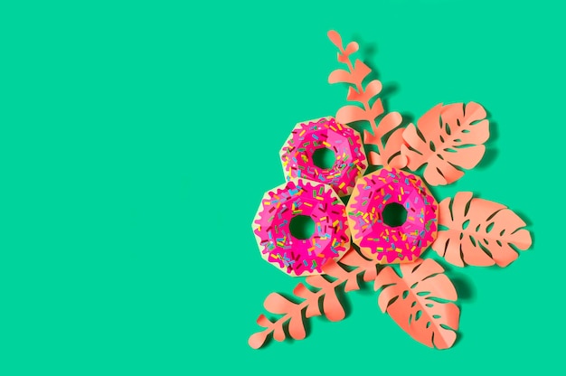 Pink paper donuts and pink leaves